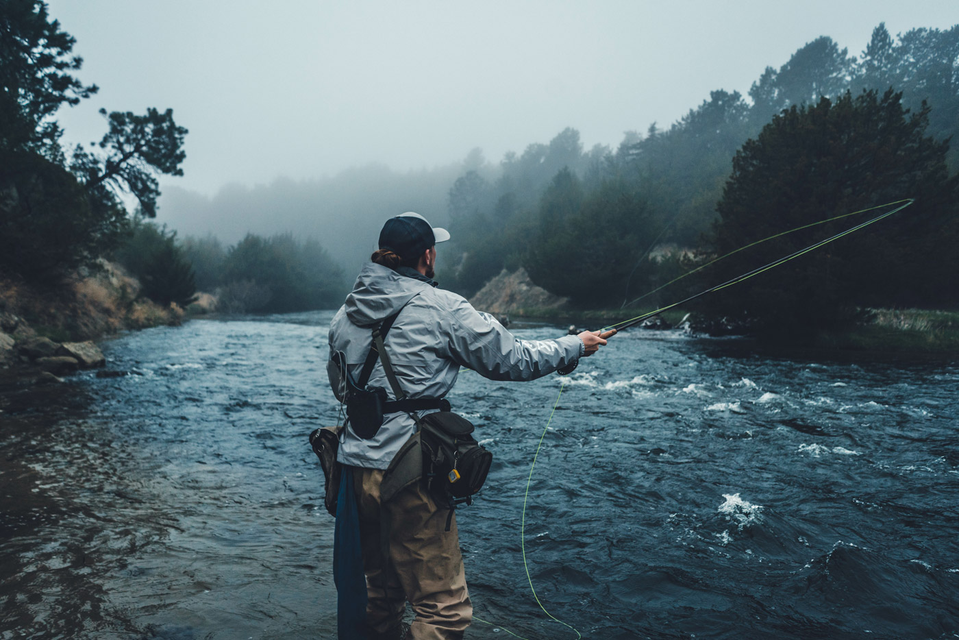 Fishing guide casting a line