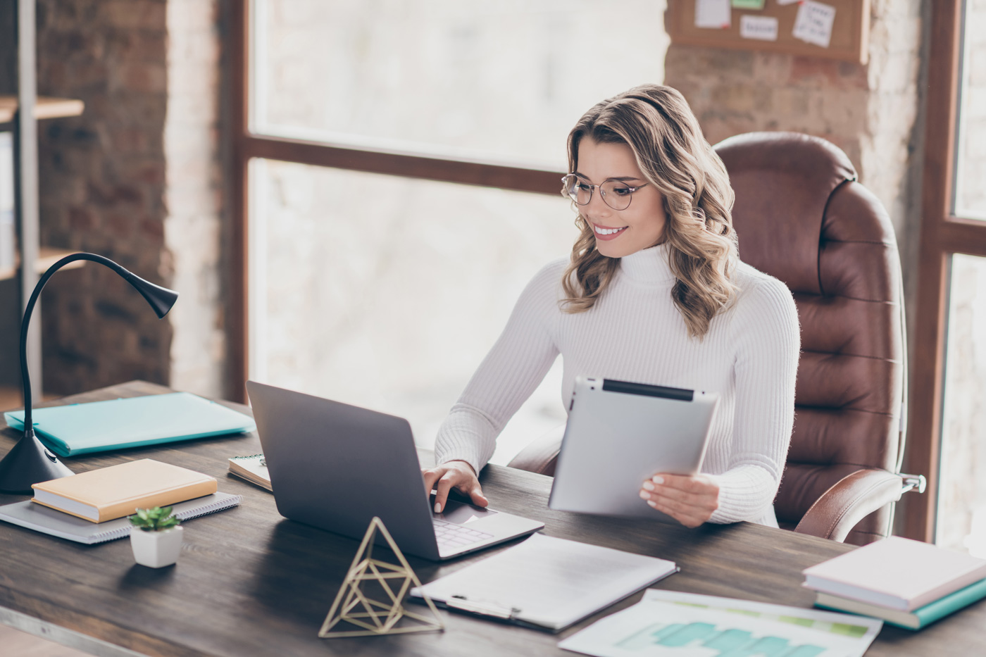Female insurance broker working in her office