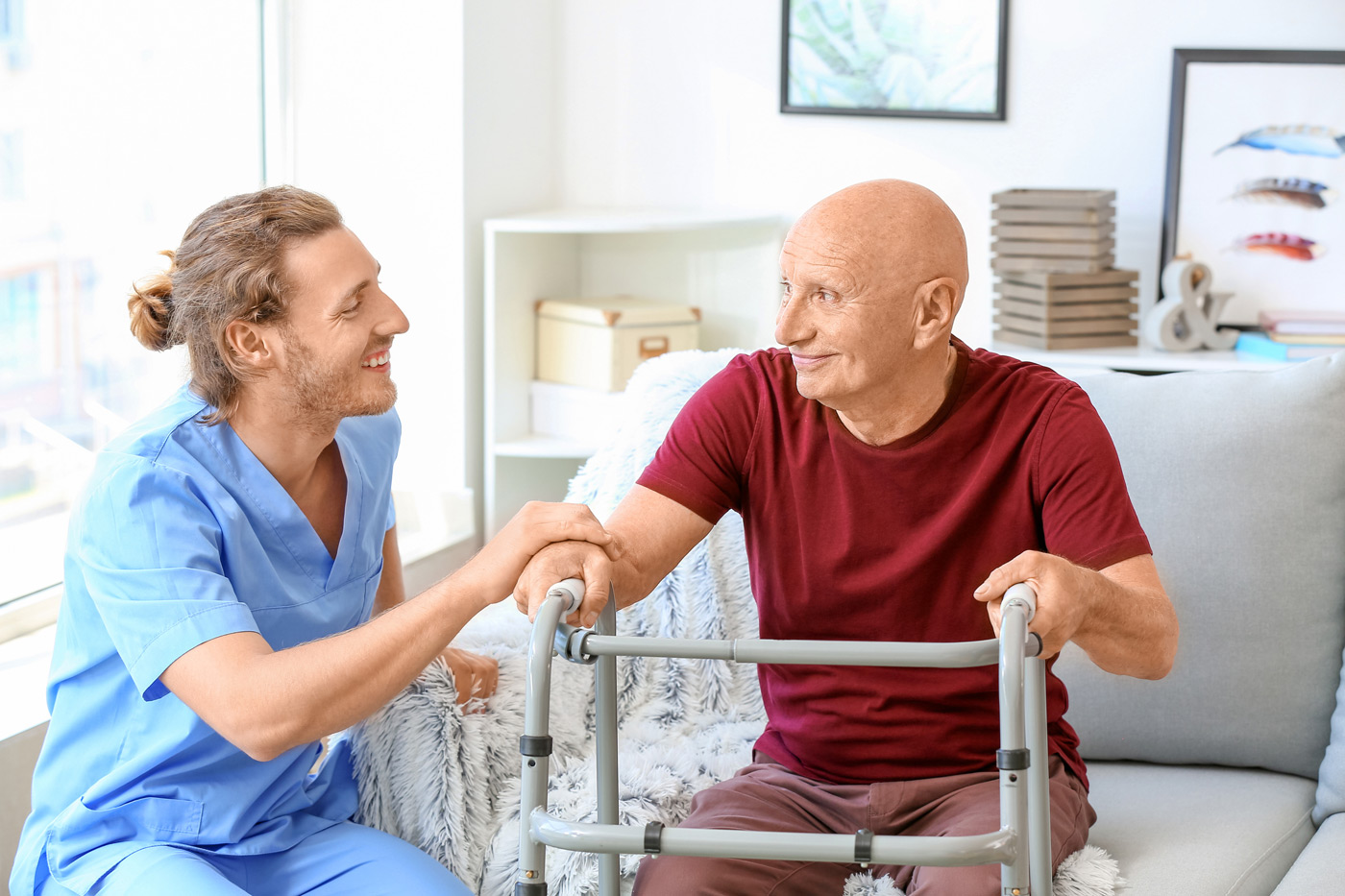 Nurse working with an older man in a nursing home