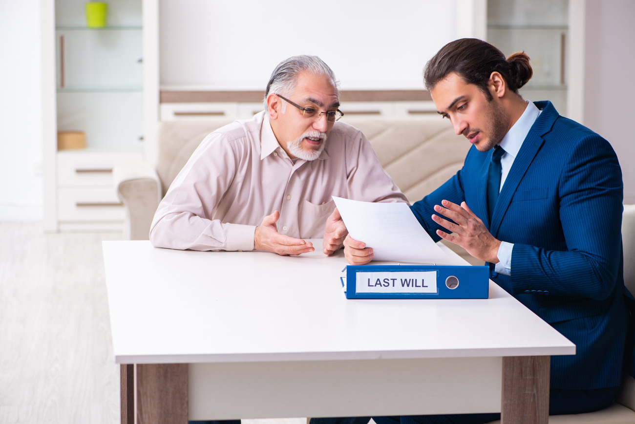 Bonded executor meeting with a lawyer to discuss deceased person’s will