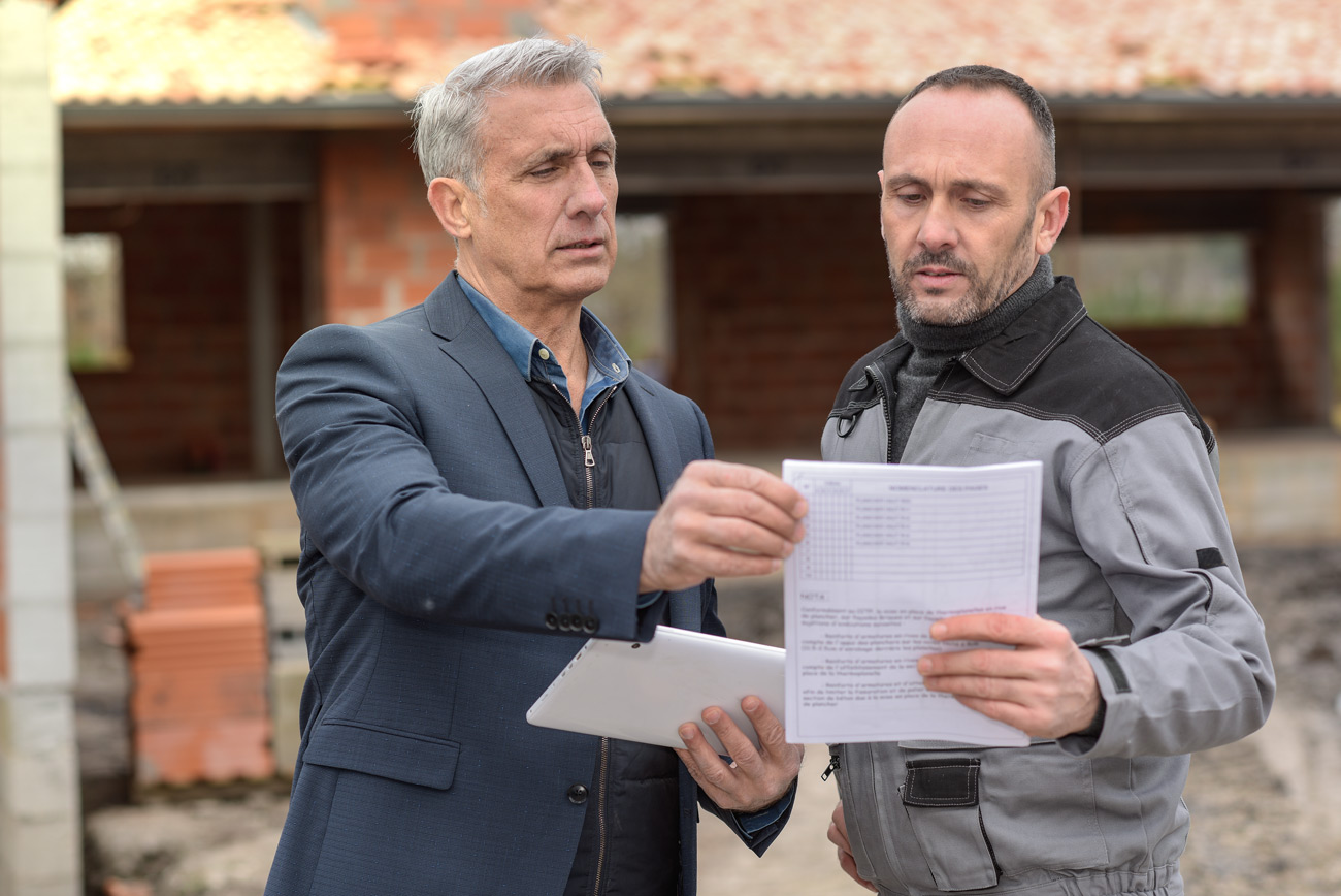 Project developer with a release of lien bond talking with a general contractor